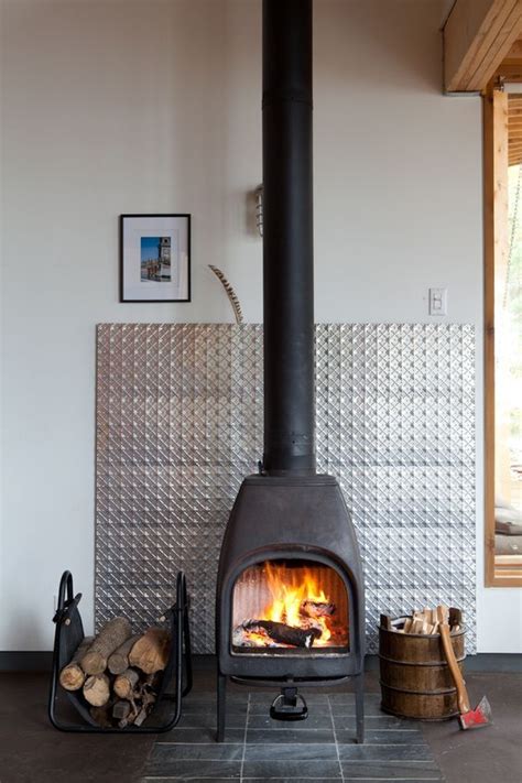 sheet metal wood burning stove|metal behind wood stove.